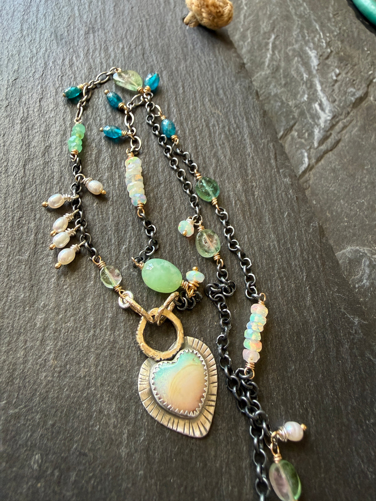 Wire wrapped gemstones with a Boulder Opal Heart