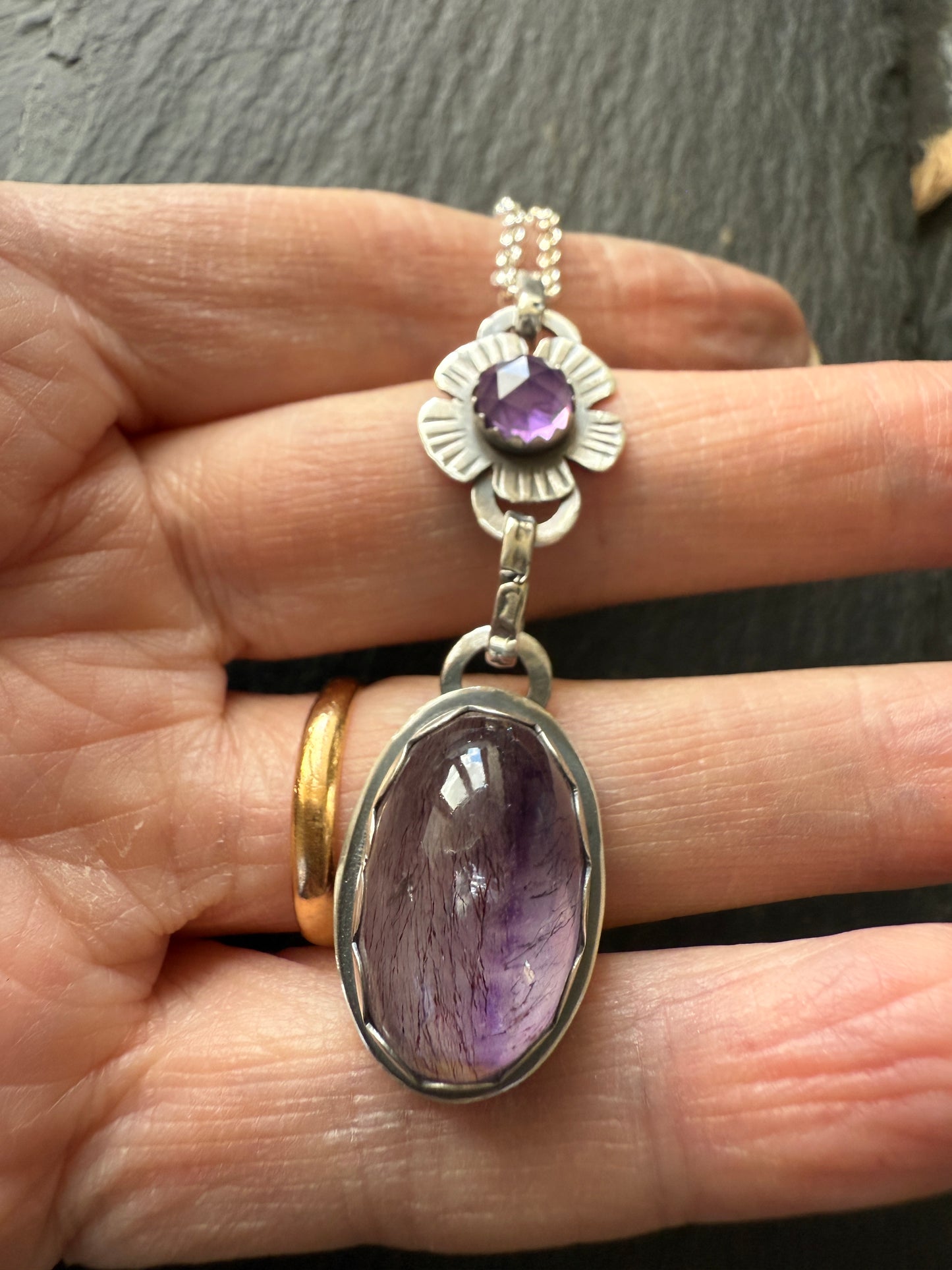 Super Seven stone with an Amethyst's pendant