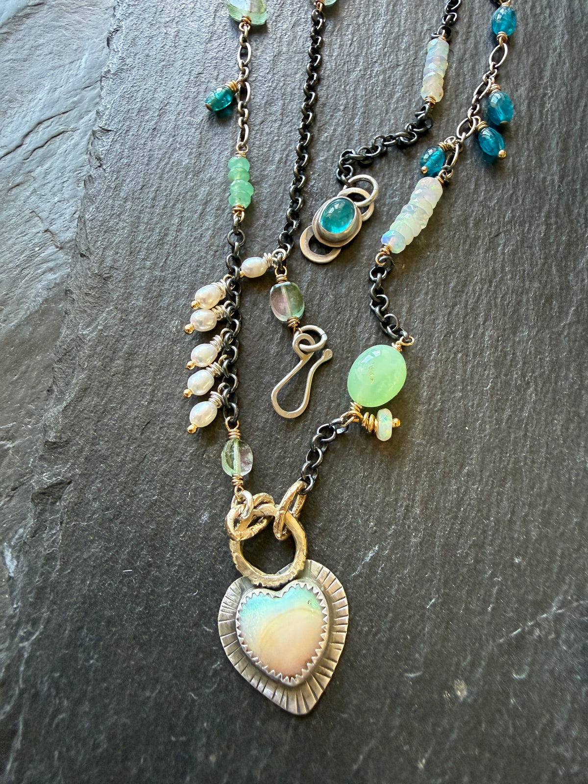 Wire wrapped gemstones with a Boulder Opal Heart