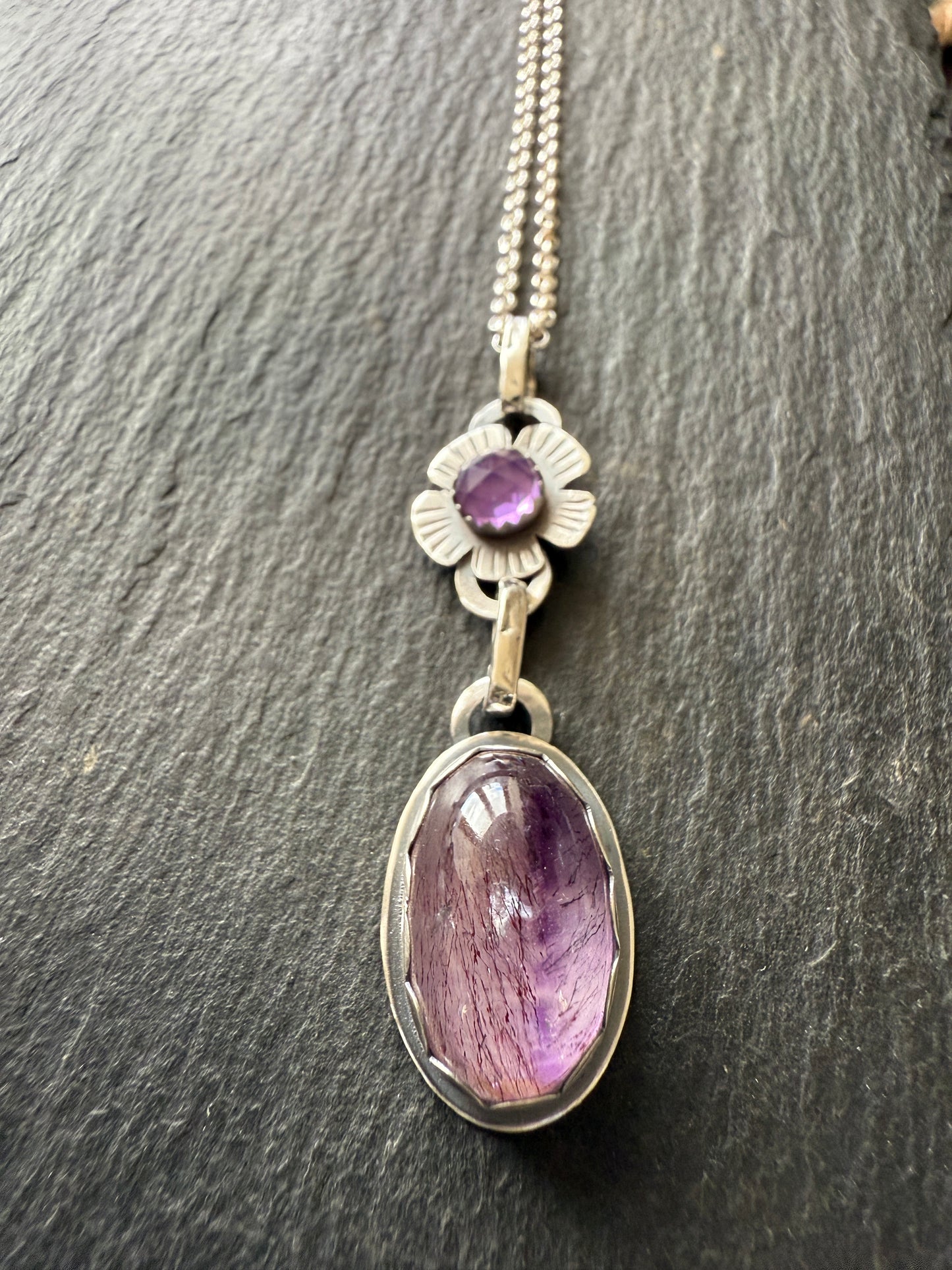 Super Seven stone with an Amethyst's pendant