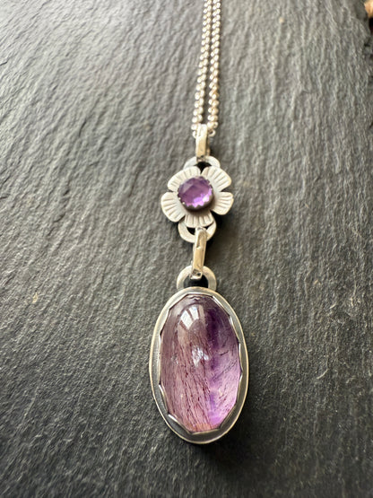 Super Seven stone with an Amethyst's pendant
