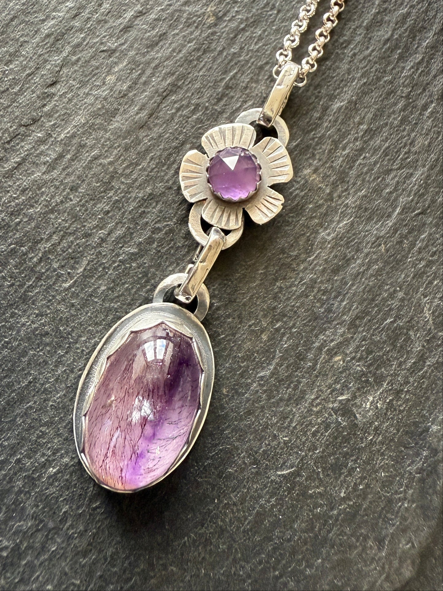 Super Seven stone with an Amethyst's pendant