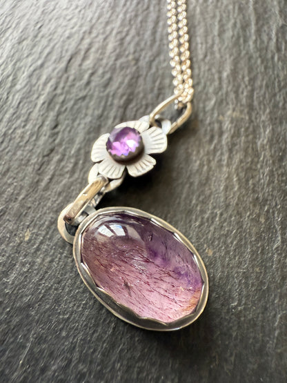 Super Seven stone with an Amethyst's pendant