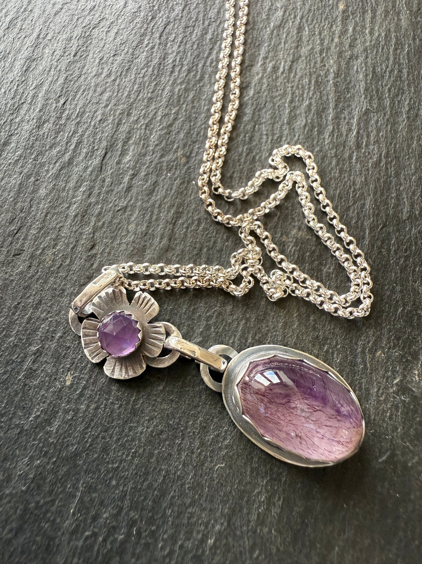 Super Seven stone with an Amethyst's pendant