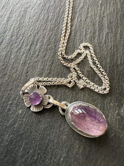 Super Seven stone with an Amethyst's pendant