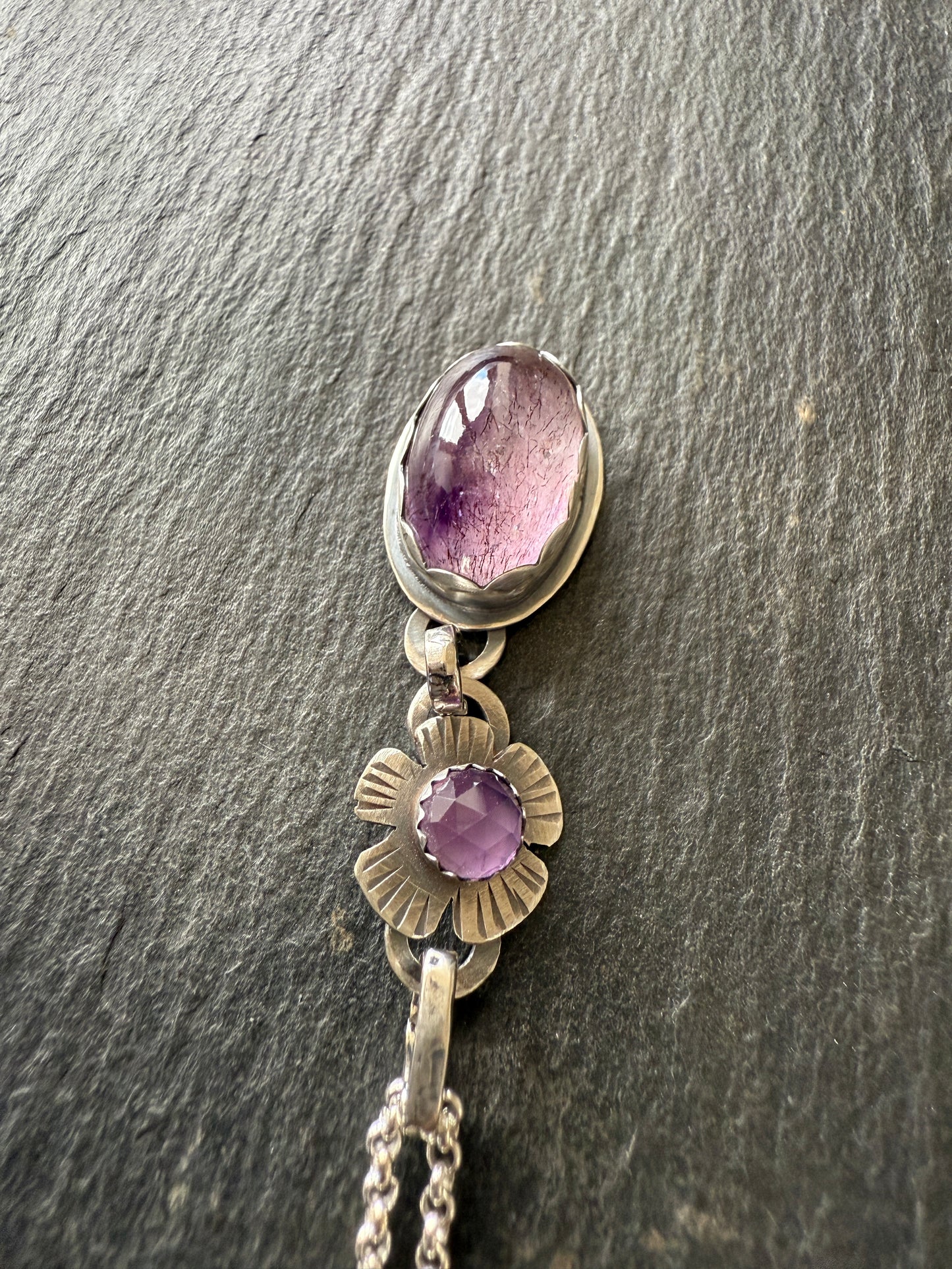 Super Seven stone with an Amethyst's pendant