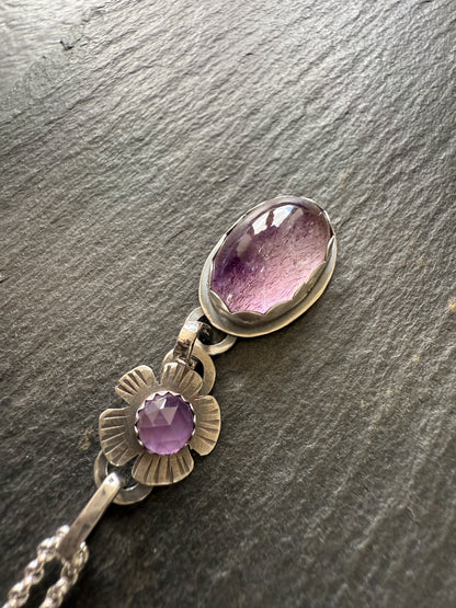 Super Seven stone with an Amethyst's pendant