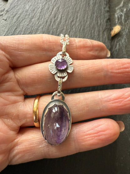 Super Seven stone with an Amethyst's pendant