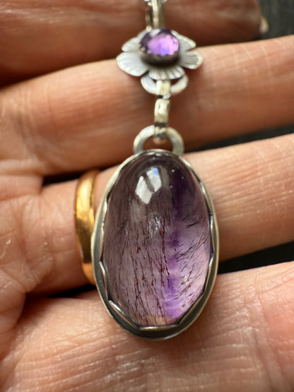 Super Seven stone with an Amethyst's pendant