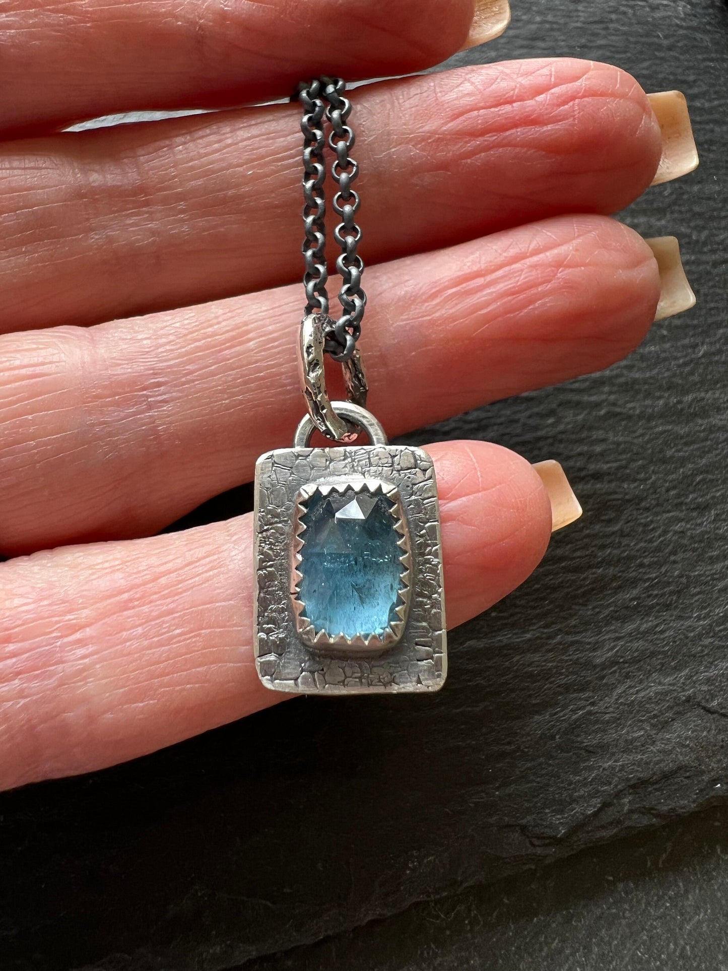 Petite aquamarine necklace, bezel set blue gemstone with sterling silver