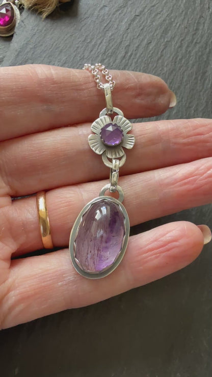 Super Seven stone with an Amethyst's pendant
