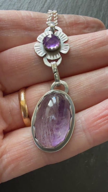 Super Seven stone with an Amethyst's pendant